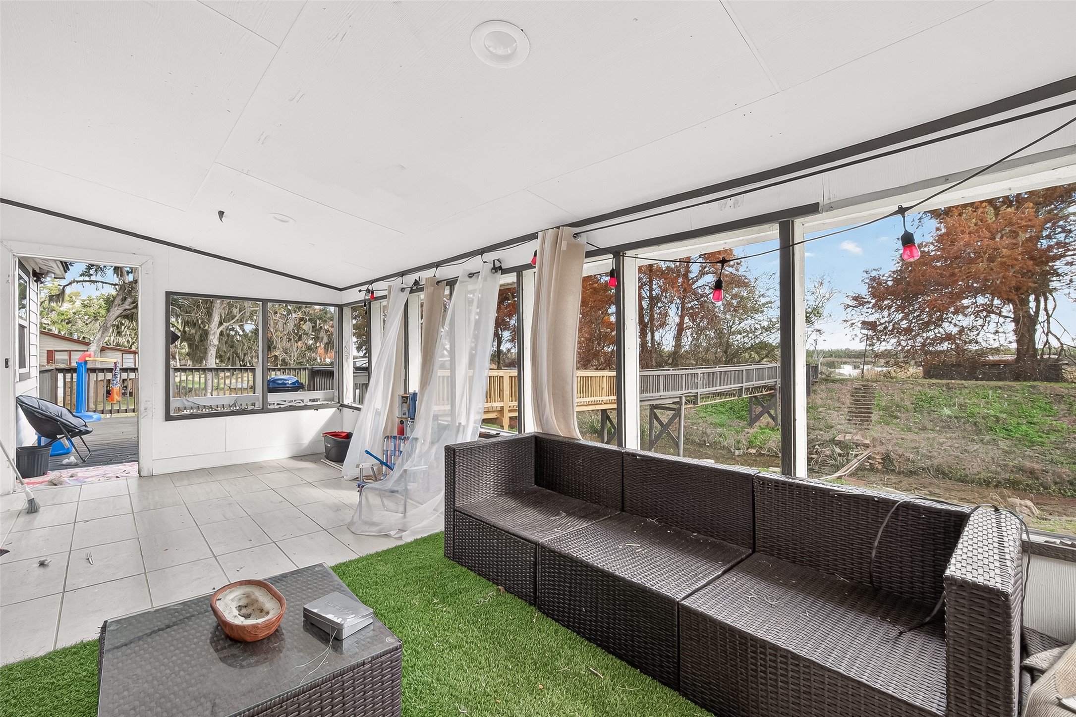 29927 County Road 25 Damon, TX 77430 - Photo 28 of 43 a living room with furniture and a floor to ceiling window