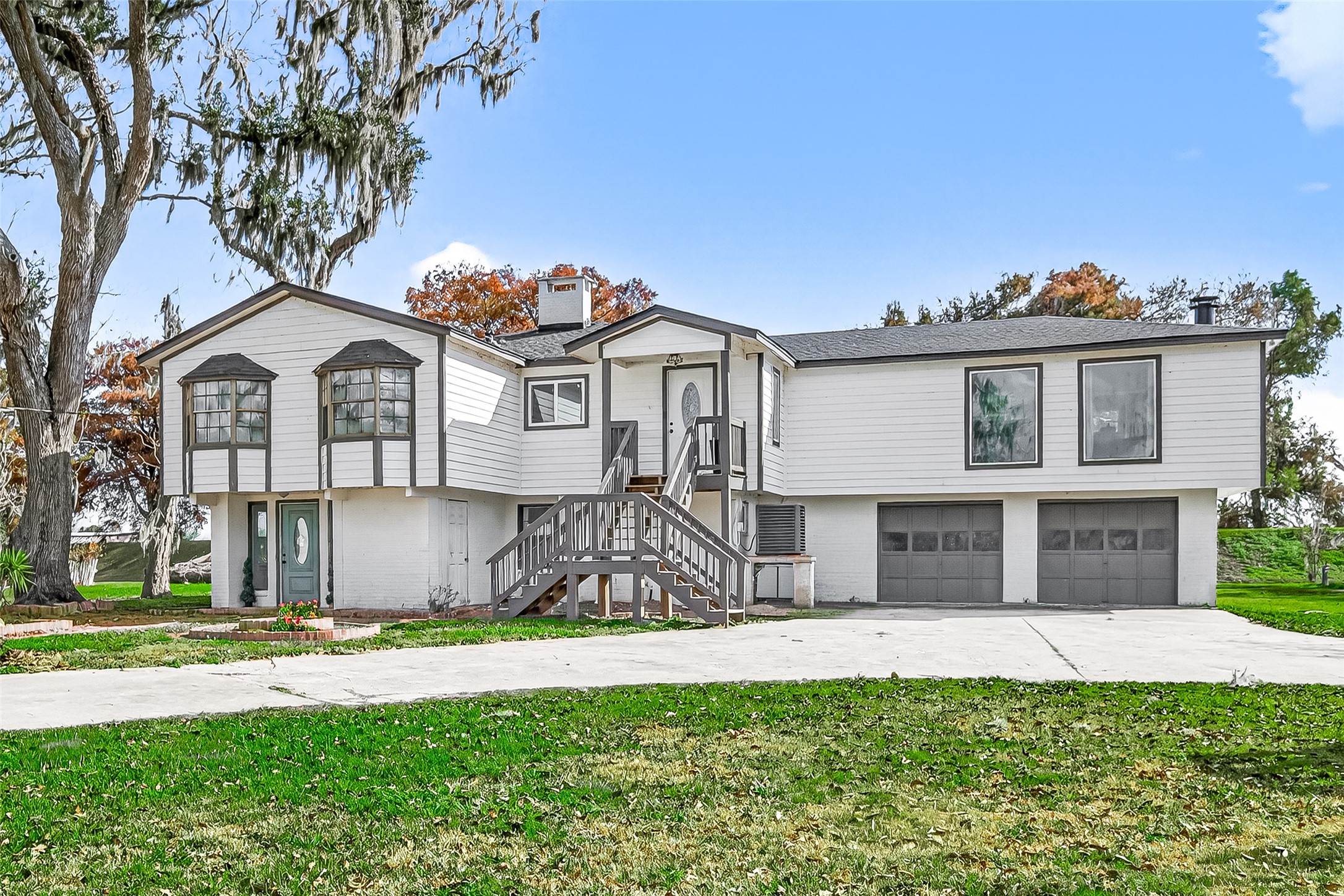 29927 County Road 25 Damon, TX 77430 - Photo 3 of 43 a front view of a house with a garden and yard