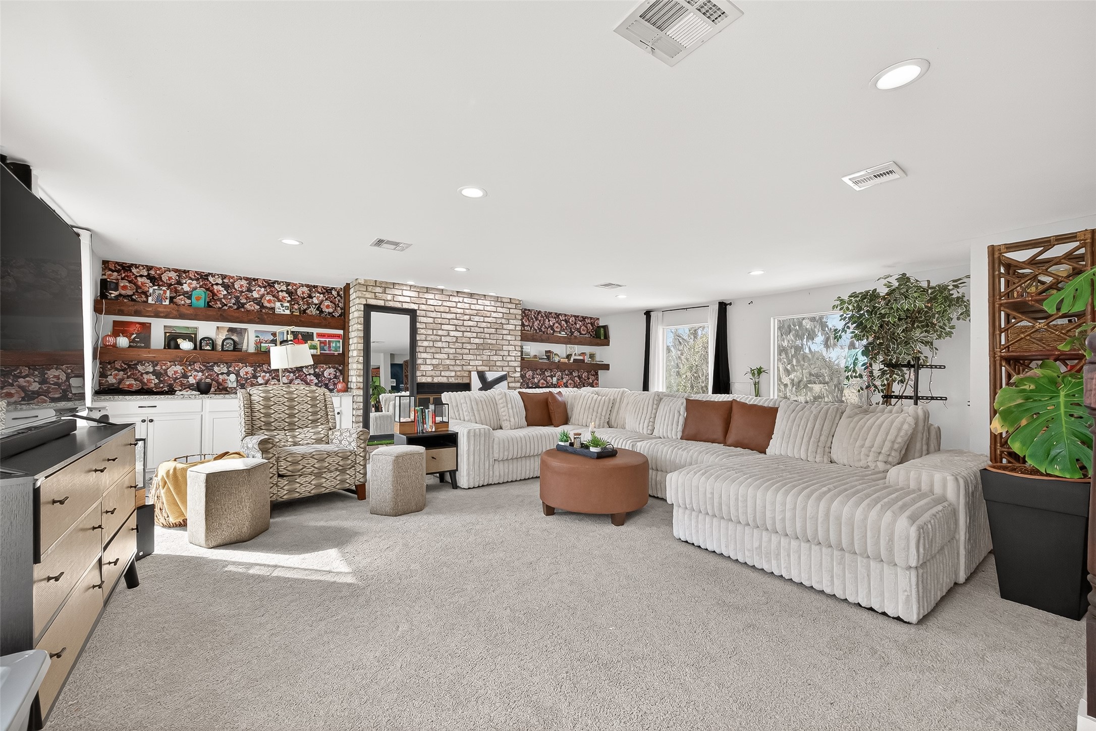 29927 County Road 25 Damon, TX 77430 - Photo 6 of 43 a living room with furniture and a flat screen tv