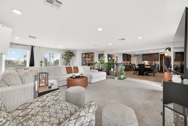 a bedroom with a bed and a mirror