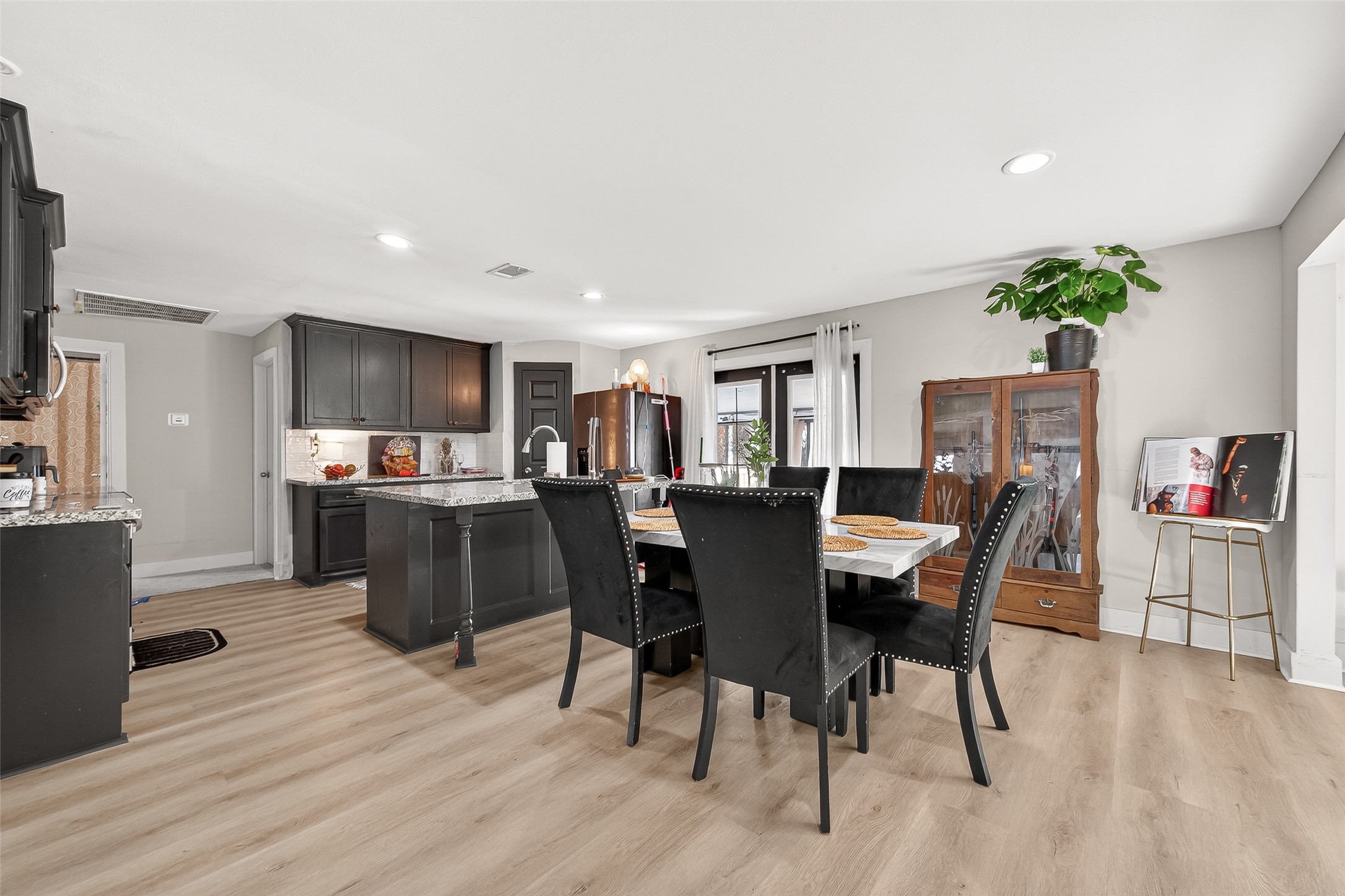29927 County Road 25 Damon, TX 77430 - Photo 9 of 43 a view of a dining room with furniture and wooden floor