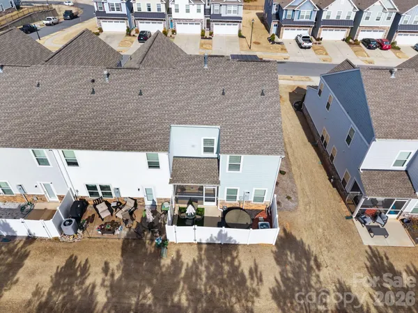 an aerial view of a house with outdoor space