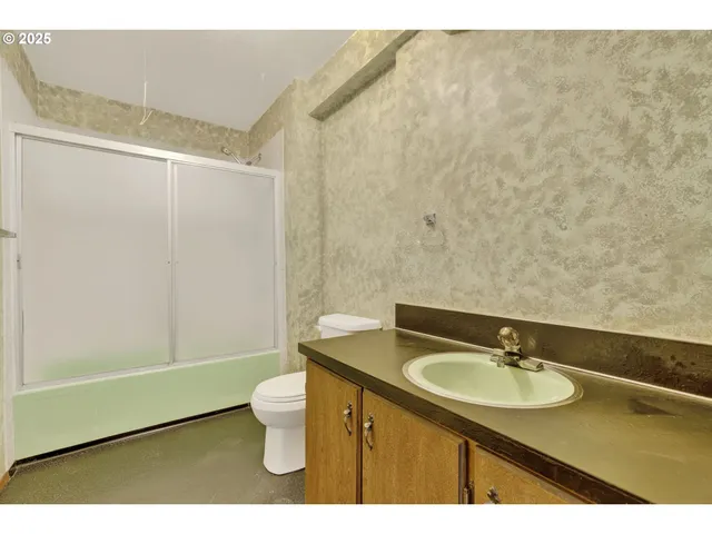 a bathroom with a sink and mirror