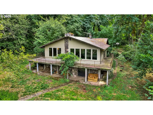 a balcony with a table and chairs