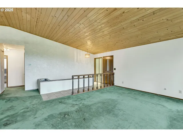 a view of an empty room with stairs