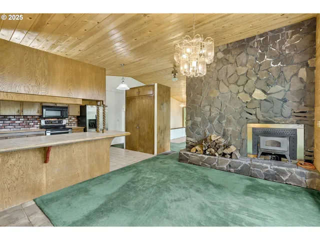 a view of a living room and kitchen