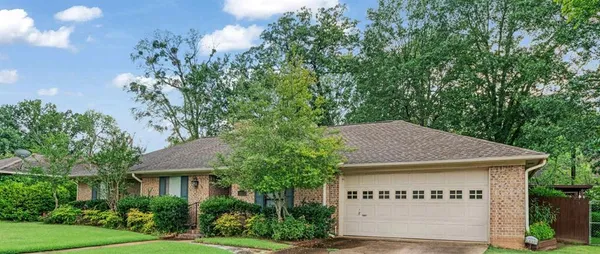 a view of a house with a tree