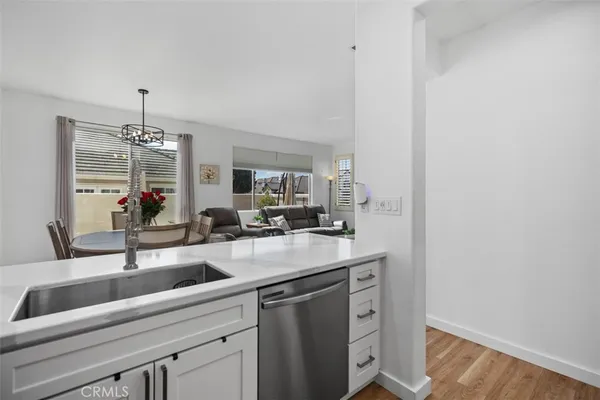a kitchen with a sink and a refrigerator