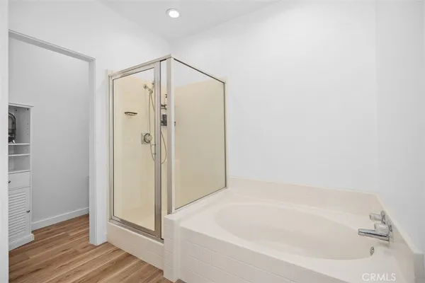 a bathroom with a bathtub and a shower