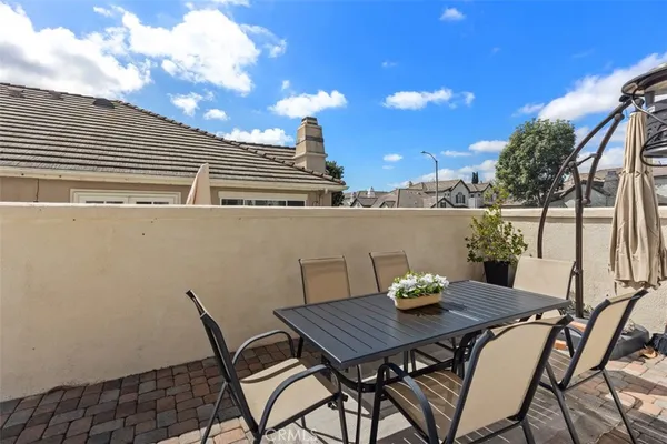 a view of a chairs and table in the terrace