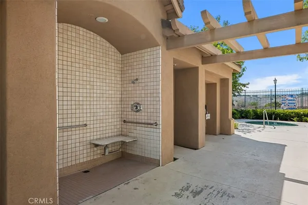 a swimming pool with outdoor seating and yard