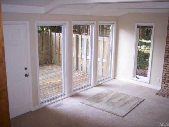 4909 Mandel Road Durham, NC 27712 - Photo 4 of 10 Sunroom with view of deck.