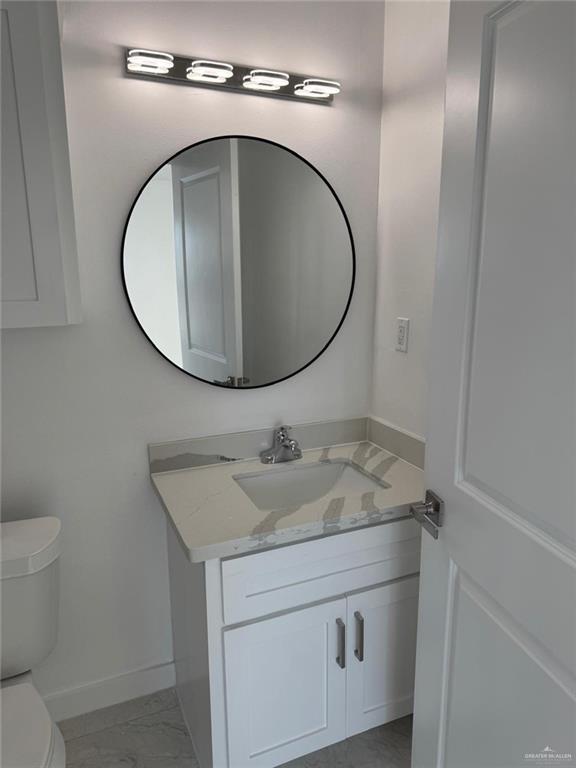 4912 South 36th Street McAllen, TX 78503 - Photo 11 of 15 a bathroom with a sink and a mirror