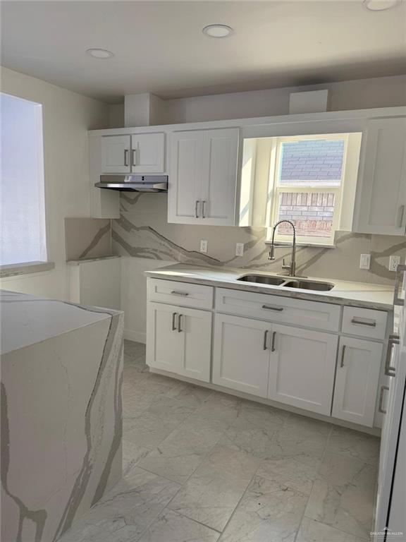 4912 South 36th Street McAllen, TX 78503 - Photo 5 of 15 a kitchen with cabinets appliances a sink and a window