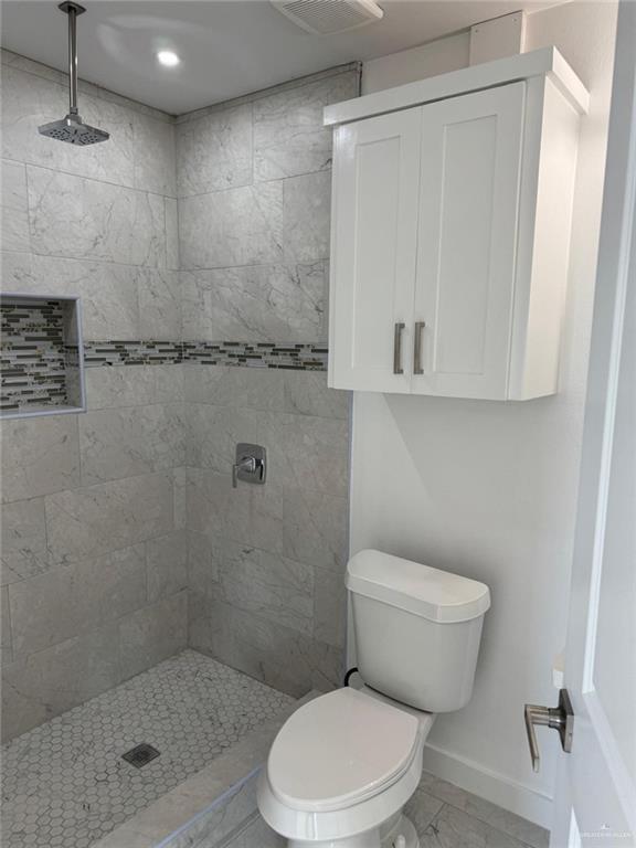 4912 South 36th Street McAllen, TX 78503 - Photo 10 of 15 a bathroom with a toilet and a shower