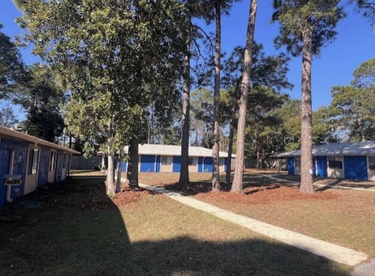 1925 Esplanade Street, Unit F Navarre, FL 32566 - Photo 1 of 13 a view of city with tall buildings