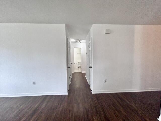 1925 Esplanade Street, Unit F Navarre, FL 32566 - Photo 13 of 13 a view of an empty room with wooden floor