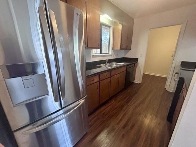 1925 Esplanade Street, Unit F Navarre, FL 32566 - Photo 5 of 13 a kitchen with sink a refrigerator and trees