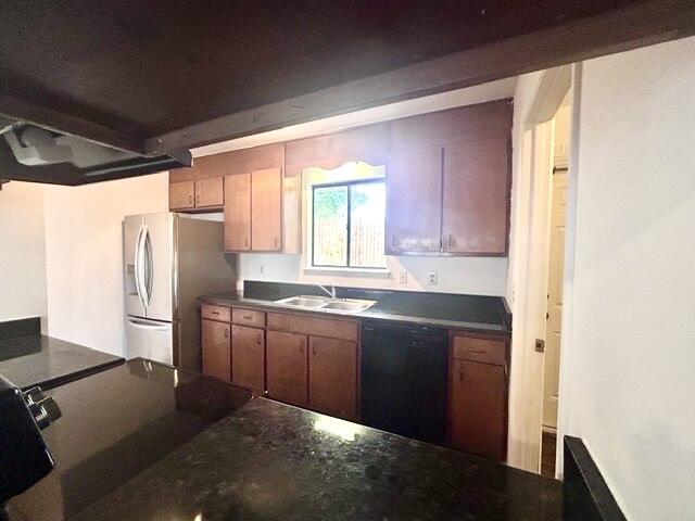 1925 Esplanade Street, Unit F Navarre, FL 32566 - Photo 6 of 13 a kitchen with granite countertop a refrigerator and a sink