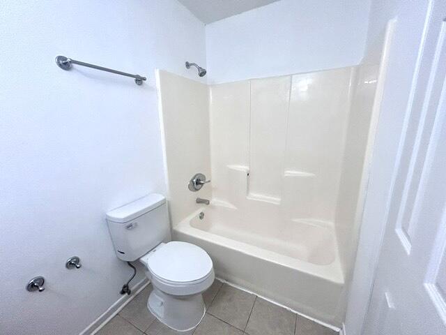 1925 Esplanade Street, Unit F Navarre, FL 32566 - Photo 8 of 13 a bathroom with a toilet and a shower