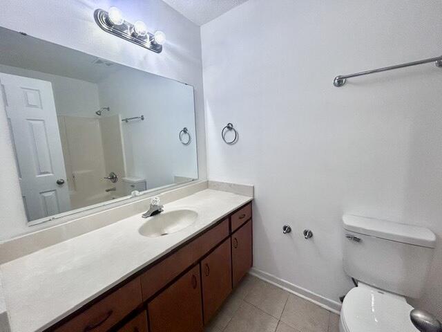1925 Esplanade Street, Unit F Navarre, FL 32566 - Photo 9 of 13 a bathroom with a sink a toilet and shower
