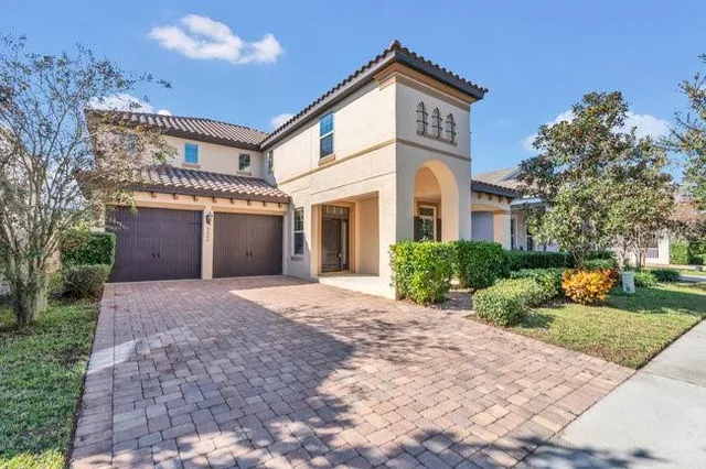 a view of a house with a yard and plants