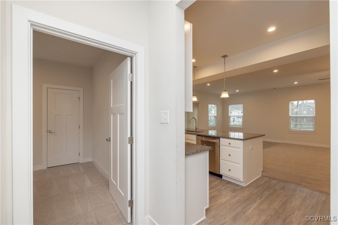 13900 Marsham Road Chester, VA 23836 - Photo 14 of 46 a open kitchen with white cabinets and stainless steel appliances