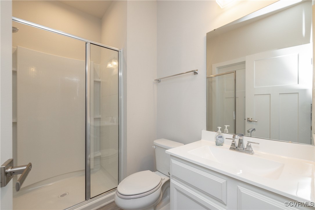 13900 Marsham Road Chester, VA 23836 - Photo 17 of 46 a bathroom with a sink a toilet and shower