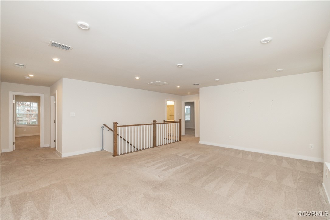 13900 Marsham Road Chester, VA 23836 - Photo 24 of 46 an empty room with stairs and entrance to other room