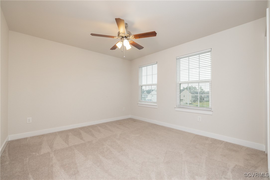 13900 Marsham Road Chester, VA 23836 - Photo 26 of 46 an empty room with windows and fan