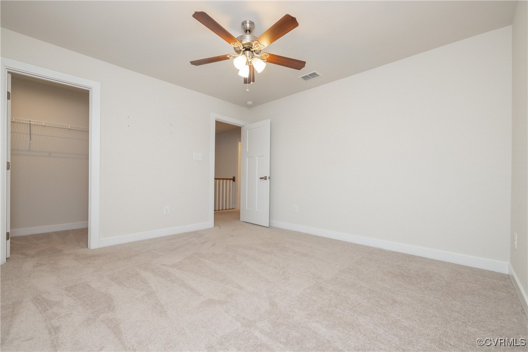 13900 Marsham Road Chester, VA 23836 - Photo 27 of 46 an empty room with closet and a ceiling fan
