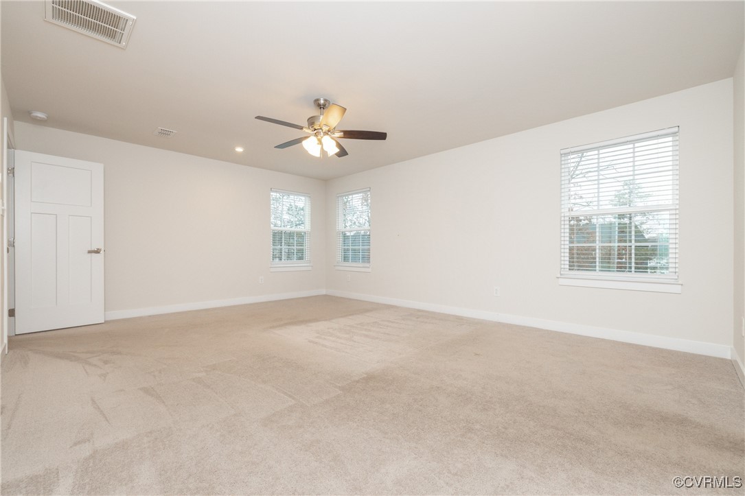 13900 Marsham Road Chester, VA 23836 - Photo 35 of 46 an empty room with windows and ceiling fan