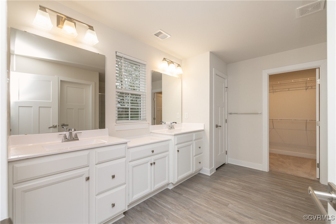 13900 Marsham Road Chester, VA 23836 - Photo 37 of 46 a bathroom with double sink and a mirror