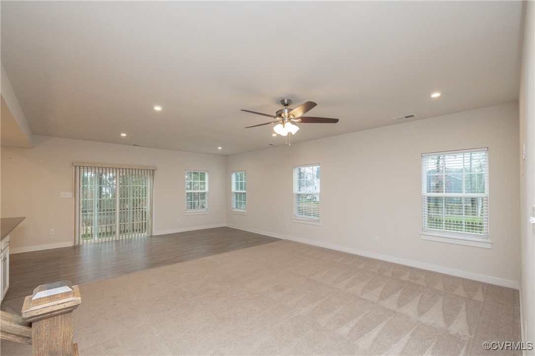 13900 Marsham Road Chester, VA 23836 - Photo 5 of 46 an empty room with windows and ceiling fan