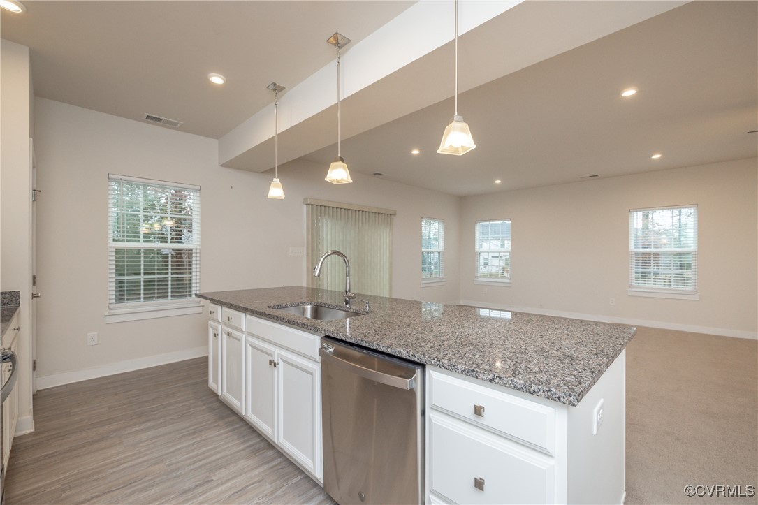 13900 Marsham Road Chester, VA 23836 - Photo 10 of 46 a kitchen with a sink stove and cabinets