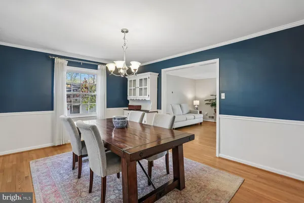 a view of a dining room with furniture and window