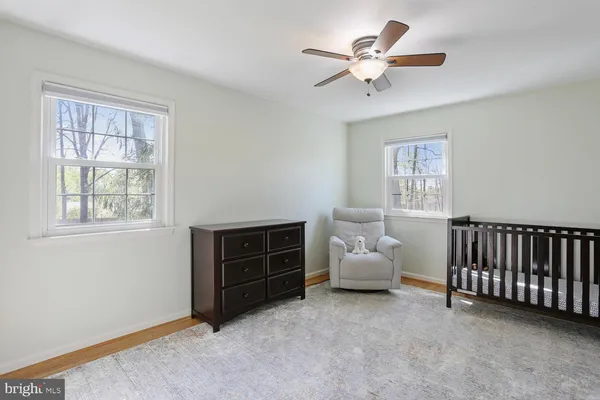 a bedroom with furniture and window