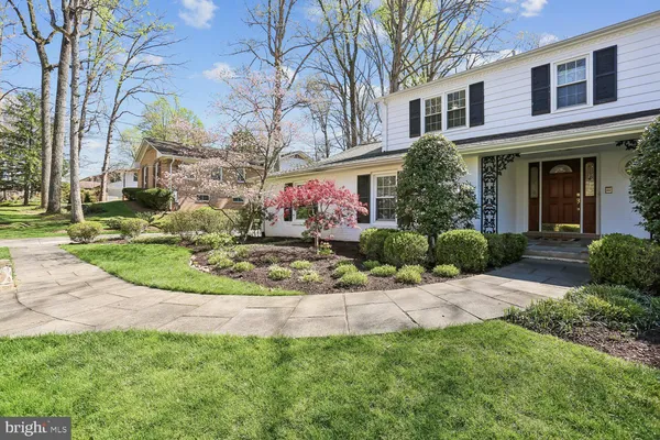 a view of a house with a yard and garage