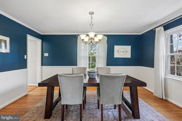 a view of a dining room with furniture and window
