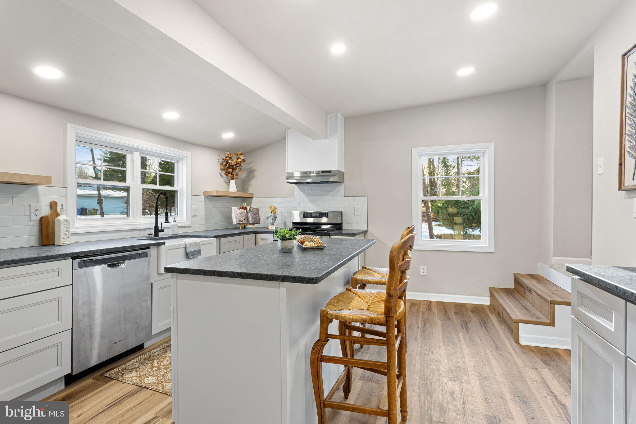 595 Church Road Sewell, NJ 08080 - Photo 12 of 32 a kitchen with stainless steel appliances granite countertop counter space a sink and a window