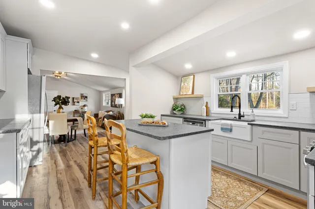 a kitchen with lots of counter top space and living room