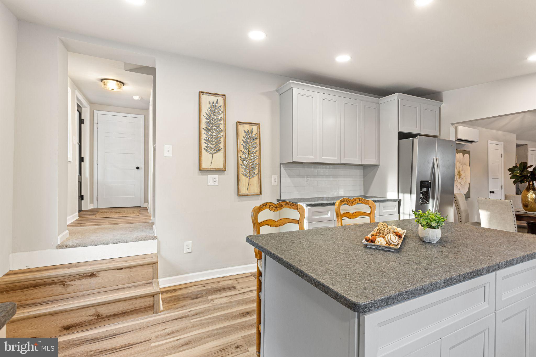 595 Church Road Sewell, NJ 08080 - Photo 14 of 32 a kitchen with stainless steel appliances granite countertop a granite counter tops and a refrigerator