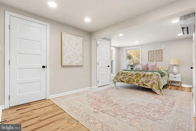 a bedroom with a large bed and a window