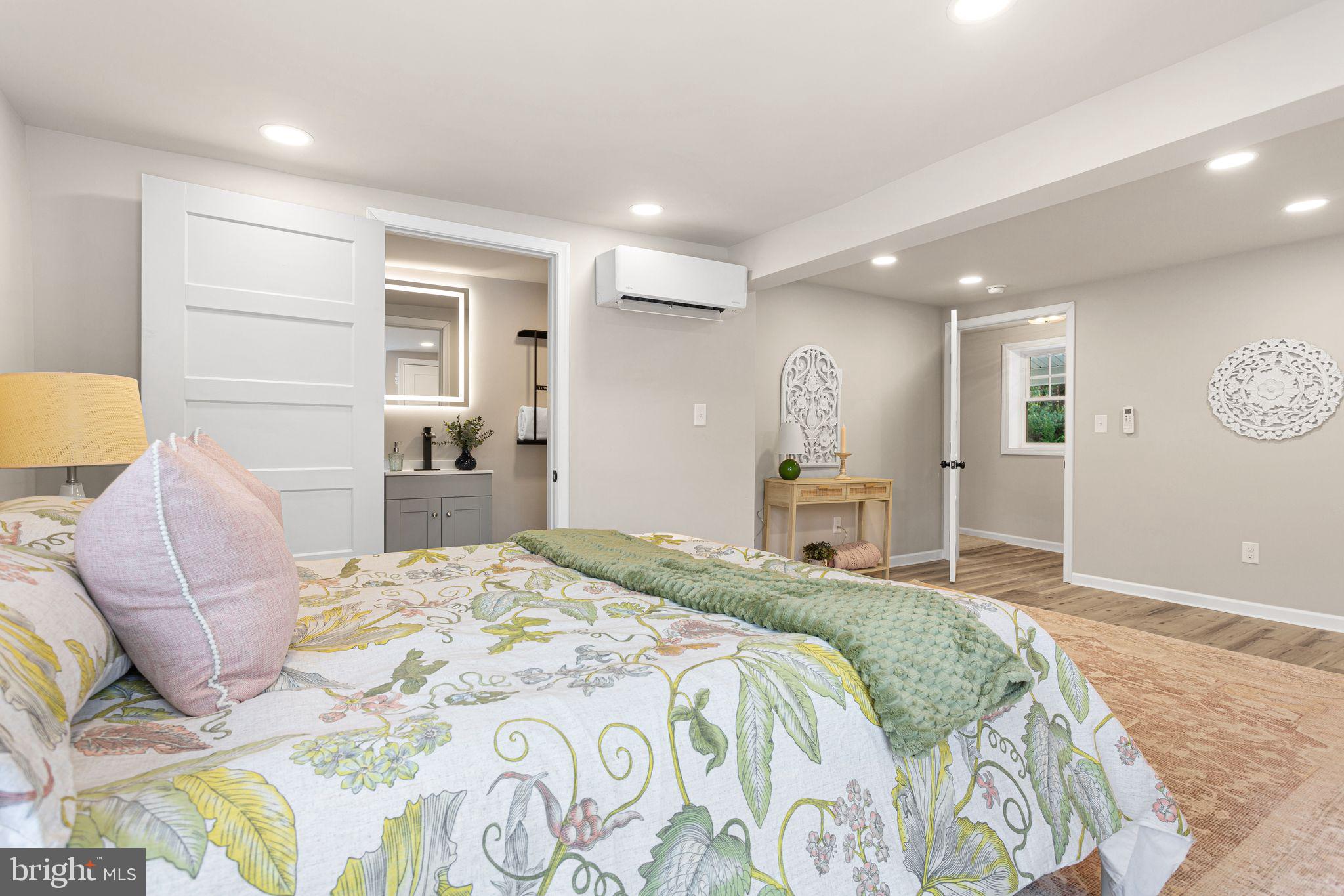 595 Church Road Sewell, NJ 08080 - Photo 16 of 32 a spacious bedroom with a bed and a couch