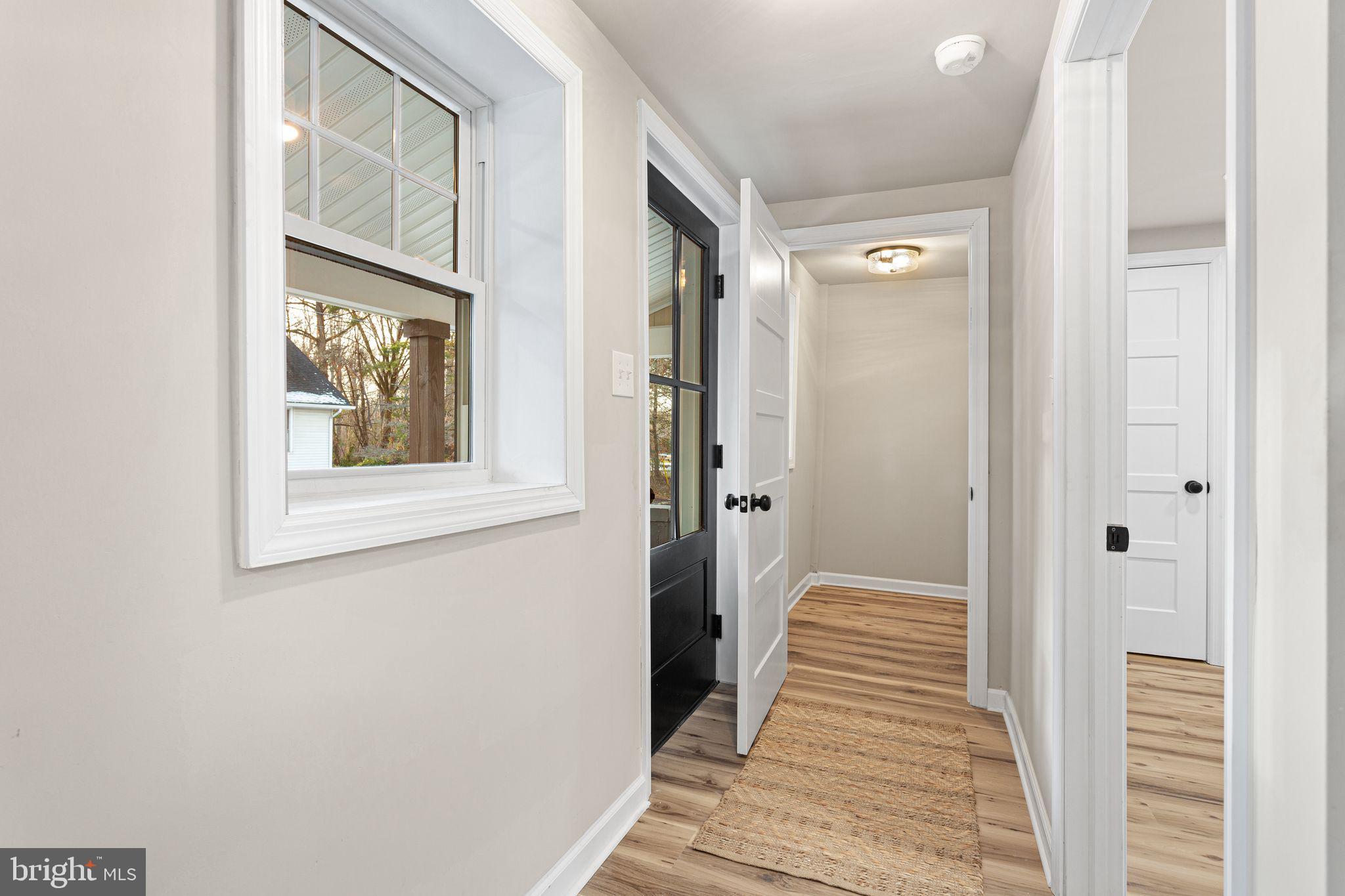 595 Church Road Sewell, NJ 08080 - Photo 19 of 32 a view of a hallway with wooden floor and staircase