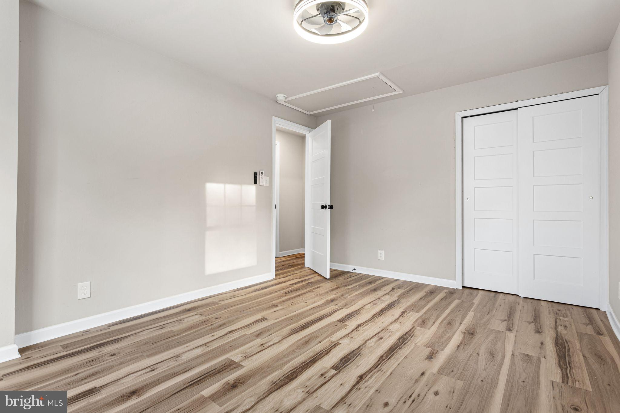 595 Church Road Sewell, NJ 08080 - Photo 21 of 32 a view of an empty room with wooden floor
