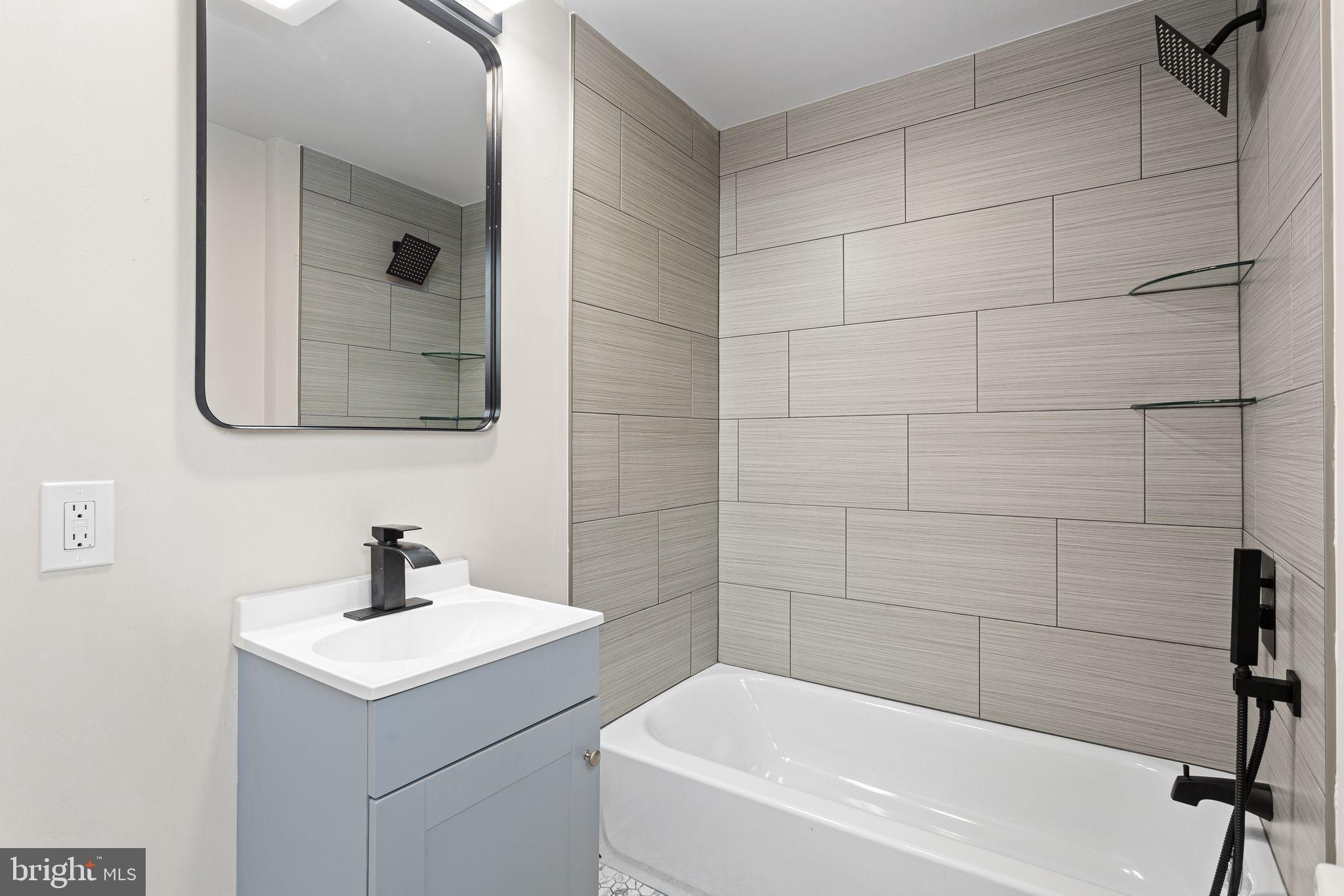 595 Church Road Sewell, NJ 08080 - Photo 24 of 32 a bathroom with a sink and a tub