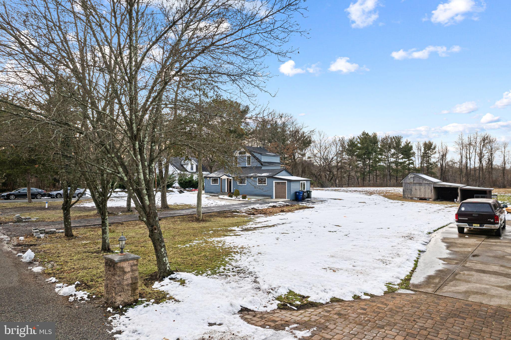 595 Church Road Sewell, NJ 08080 - Photo 27 of 32 a view of a yard with snow on the road