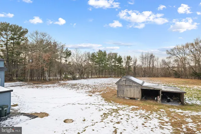 a view of a backyard of the house