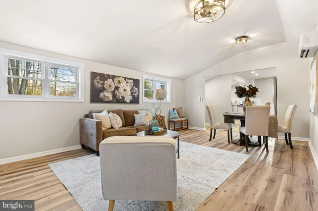 a living room with furniture and a table